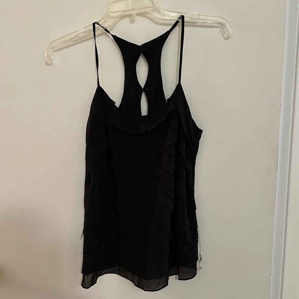 Black ruffle layer tank. In good condition. Size S.